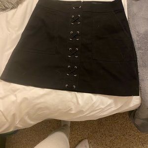 Black mini skirt with cross details
